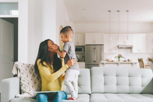 Mom and son in beautiful new house